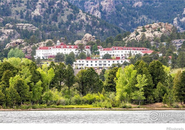 1760 Continental Peaks Cir, Estes Park, CO 80517 - drone / aerial view with a forest view and a water view