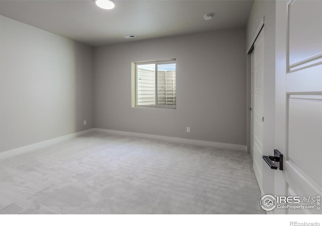 unfurnished bedroom featuring visible vents, baseboards, and carpet
