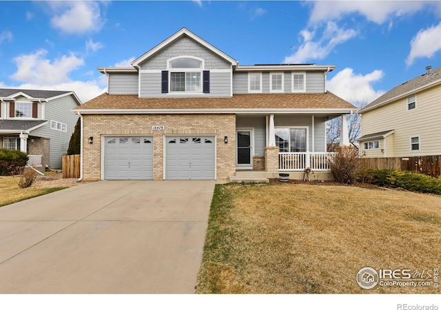 view of front of home with brick siding, fence, a porch, driveway, and an attached garage