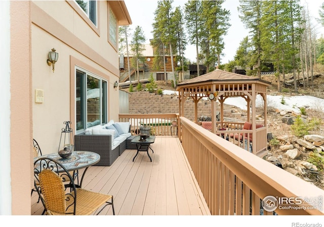 12023 Coal Creek Heights Dr, Golden, CO 80403 - wooden deck featuring a gazebo and outdoor lounge area