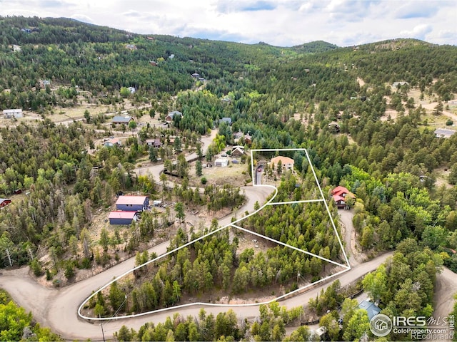 12023 Coal Creek Heights Dr, Golden, CO 80403 - aerial view featuring a wooded view and a mountain view