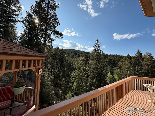 12023 Coal Creek Heights Dr, Golden, CO 80403 - wooden deck with a view of trees