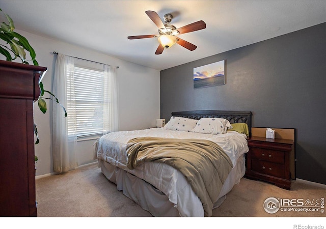 bedroom featuring carpet flooring, a ceiling fan, and baseboards
