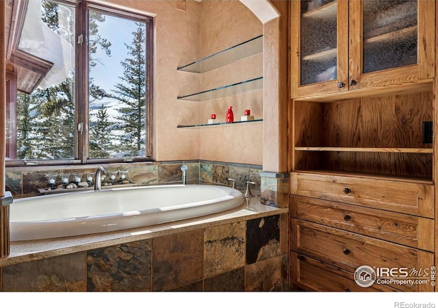 full bathroom with a garden tub