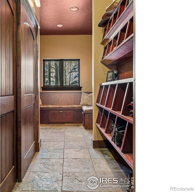 interior space with recessed lighting and stone tile flooring