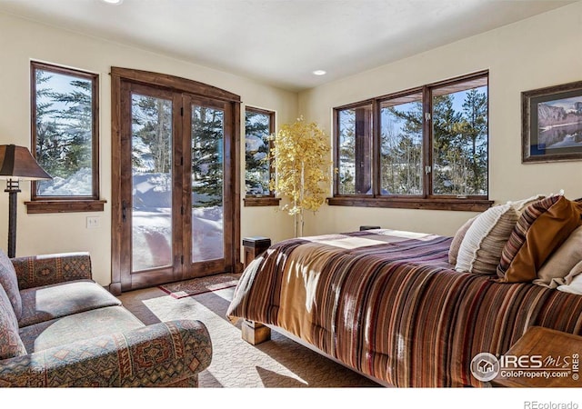 bedroom featuring recessed lighting, carpet flooring, and access to outside