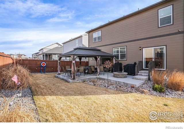 254 Ptarmigan Ln, Johnstown, CO 80534 - back of house featuring a gazebo, a patio, and a fire pit