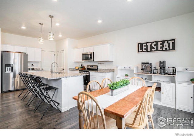 254 Ptarmigan Ln, Johnstown, CO 80534 - dining room featuring dark wood-style flooring and recessed lighting