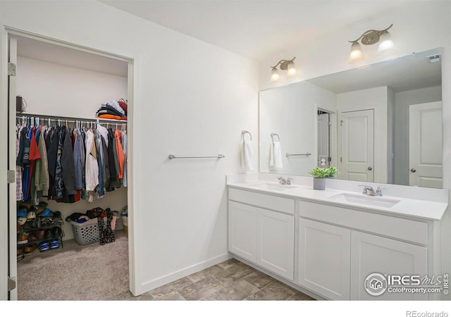 254 Ptarmigan Ln, Johnstown, CO 80534 - bathroom with double vanity and a spacious closet