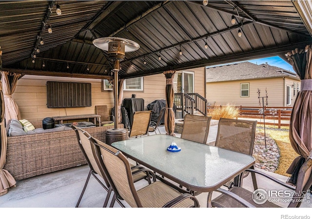254 Ptarmigan Ln, Johnstown, CO 80534 - view of patio / terrace featuring a gazebo, outdoor dining area, and an outdoor living space