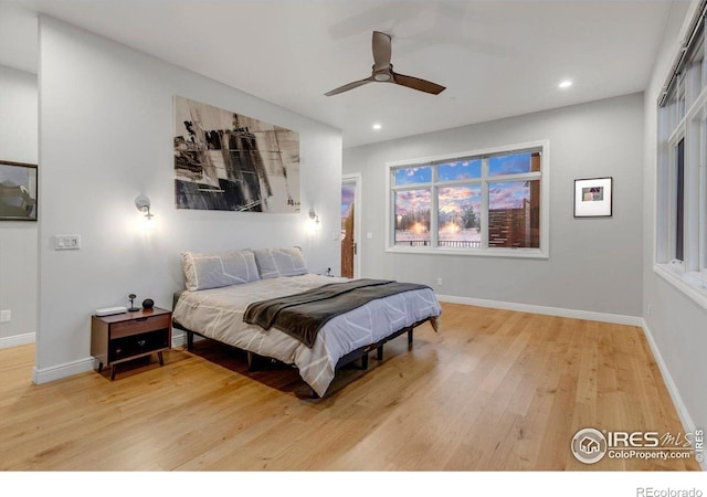 bedroom with wood finished floors, recessed lighting, baseboards, and a ceiling fan