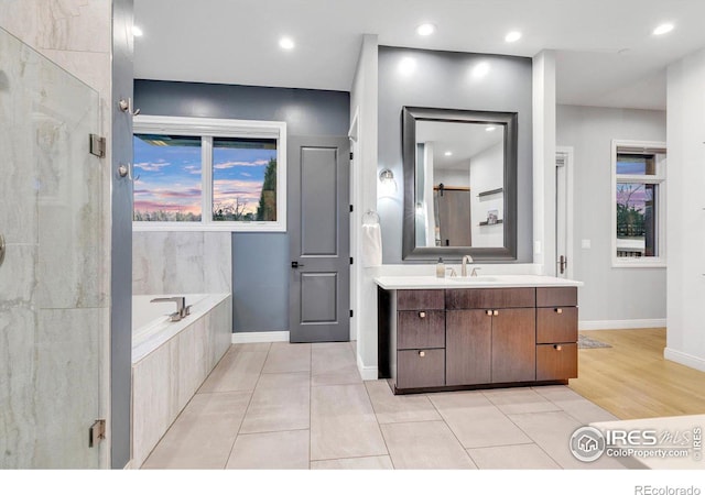 full bath with vanity, baseboards, a garden tub, tile patterned flooring, and recessed lighting
