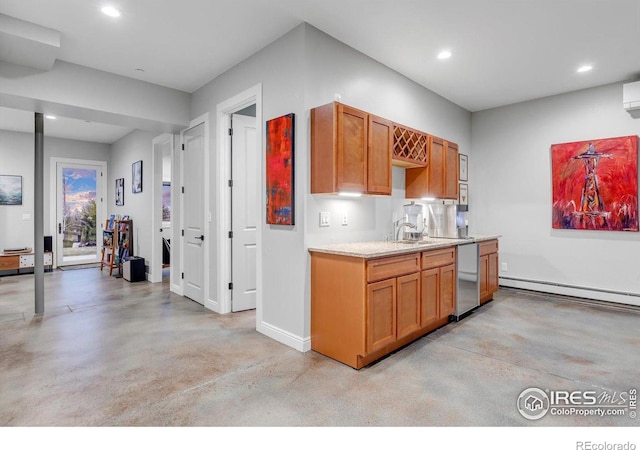 kitchen with finished concrete flooring, a baseboard heating unit, light countertops, recessed lighting, and baseboards
