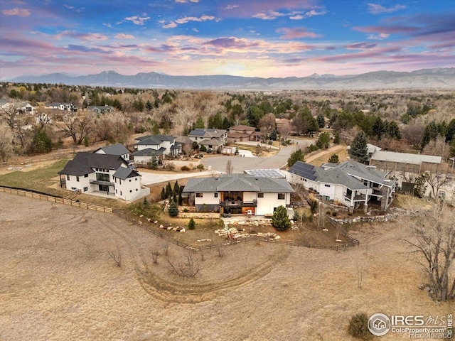 aerial view of residential area featuring mountains
