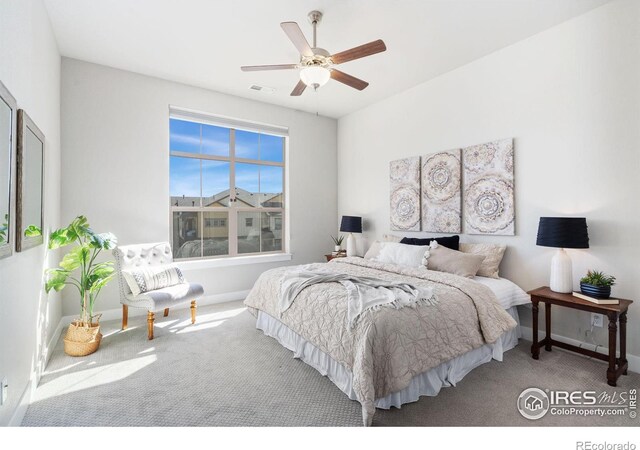 bedroom featuring visible vents, baseboards, carpet, and a ceiling fan