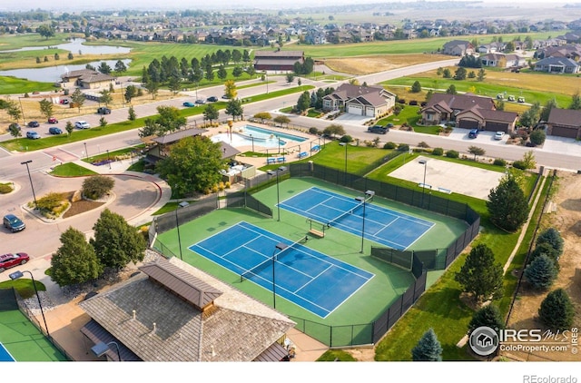 birds eye view of property with a water view and a residential view