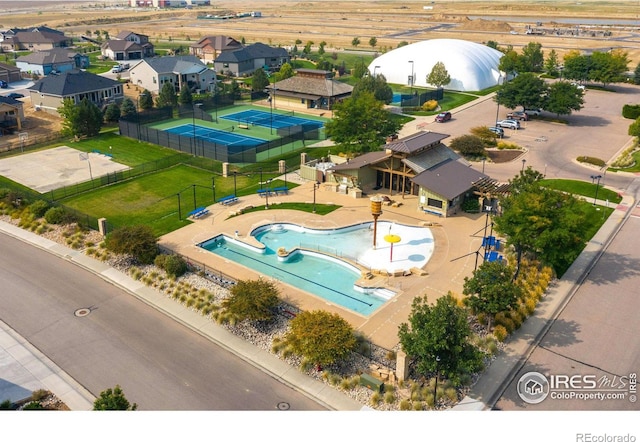 birds eye view of property with a residential view