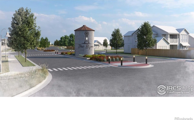 view of street with curbs, a residential view, and sidewalks