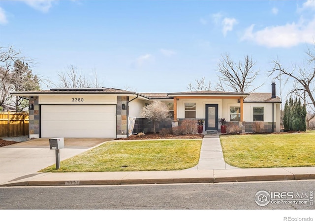 3380 Longwood Ave, Boulder, CO 80305 - view of front facade with a front yard, fence, driveway, an attached garage, and stucco siding