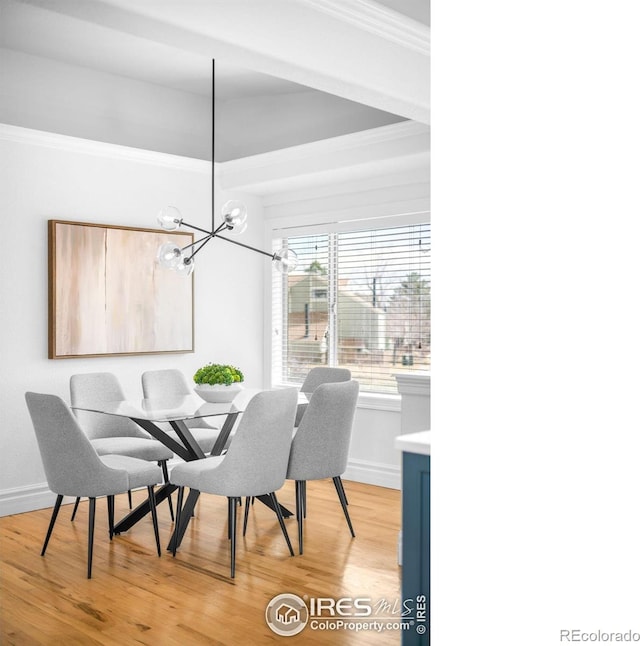 3380 Longwood Ave, Boulder, CO 80305 - dining area featuring crown molding, light wood-style flooring, baseboards, and a chandelier