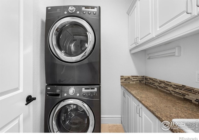 3380 Longwood Ave, Boulder, CO 80305 - laundry room featuring stacked washer / drying machine and cabinet space