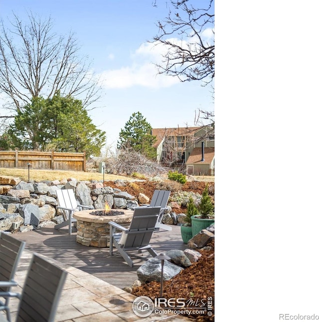 3380 Longwood Ave, Boulder, CO 80305 - view of patio with an outdoor fire pit and fence