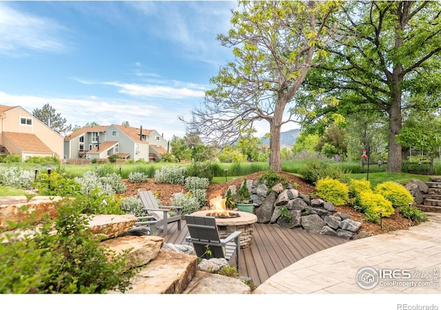 3380 Longwood Ave, Boulder, CO 80305 - view of yard with a fire pit and a deck