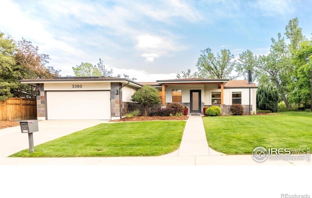 3380 Longwood Ave, Boulder, CO 80305 - view of front of home with stone siding, concrete driveway, a garage, and stucco siding