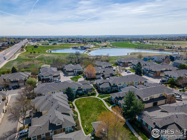 aerial view featuring a residential view and a water view