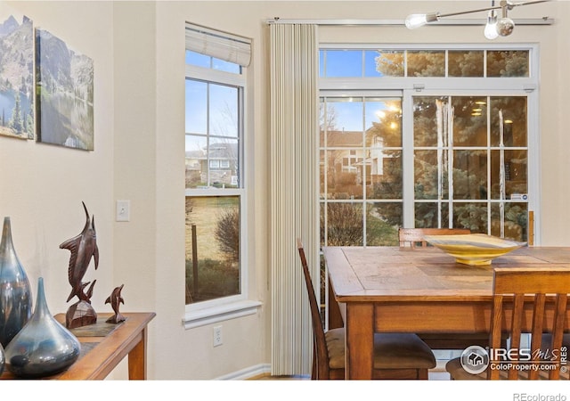 doorway to outside featuring a notable chandelier