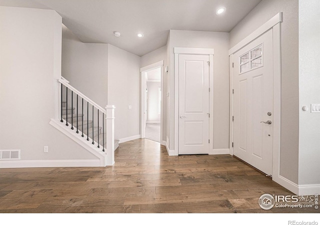 4300 Ardglass Ln, Timnath, CO 80547 - entryway featuring wood finished floors, baseboards, stairway, and recessed lighting