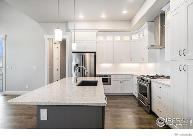 4300 Ardglass Ln, Timnath, CO 80547 - kitchen with wall chimney range hood, a sink, appliances with stainless steel finishes, dark wood-style floors, and recessed lighting