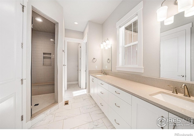 4300 Ardglass Ln, Timnath, CO 80547 - full bath with marble look tile flooring, double vanity, a stall shower, recessed lighting, and baseboards