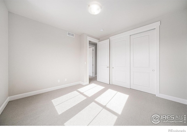 4300 Ardglass Ln, Timnath, CO 80547 - unfurnished bedroom featuring carpet flooring, baseboards, and a closet