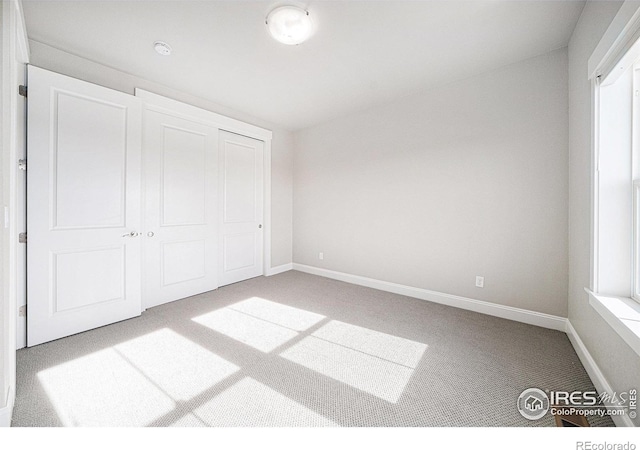 4300 Ardglass Ln, Timnath, CO 80547 - unfurnished bedroom with carpet, baseboards, and a closet