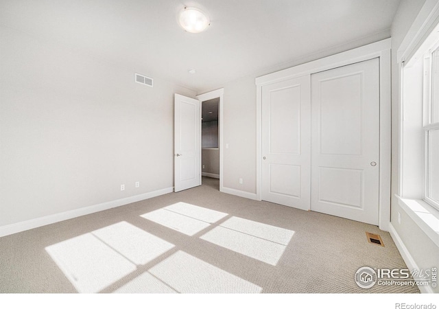 4300 Ardglass Ln, Timnath, CO 80547 - unfurnished bedroom with light carpet, baseboards, and a closet