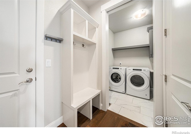4300 Ardglass Ln, Timnath, CO 80547 - laundry area with washer and dryer and dark marble finish floors