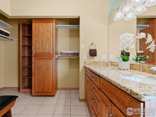 43 Scott Dr S, Broomfield, CO 80020 - full bathroom with double vanity, baseboards, and tile patterned floors