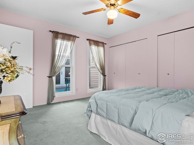 43 Scott Dr S, Broomfield, CO 80020 - bedroom featuring carpet flooring, multiple closets, and ceiling fan