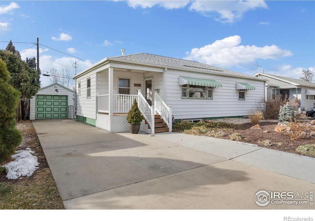 1607 Jackson Ave, Loveland, CO 80538 - view of front facade with a garage, covered porch, driveway, and an outdoor structure