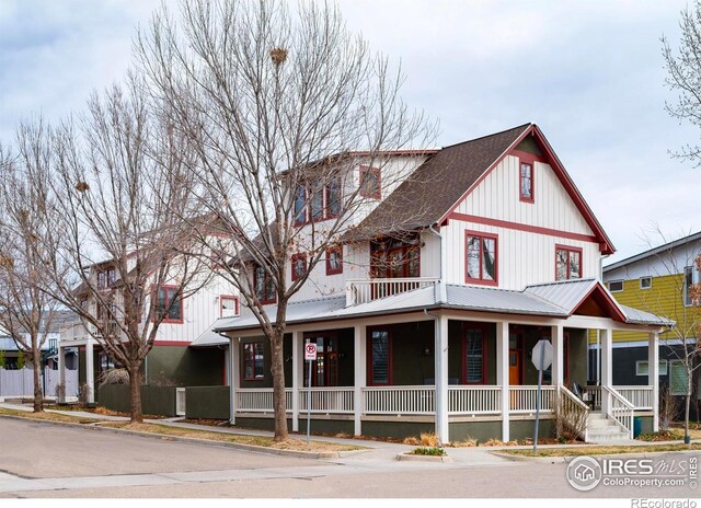 view of front facade featuring a porch and metal roof