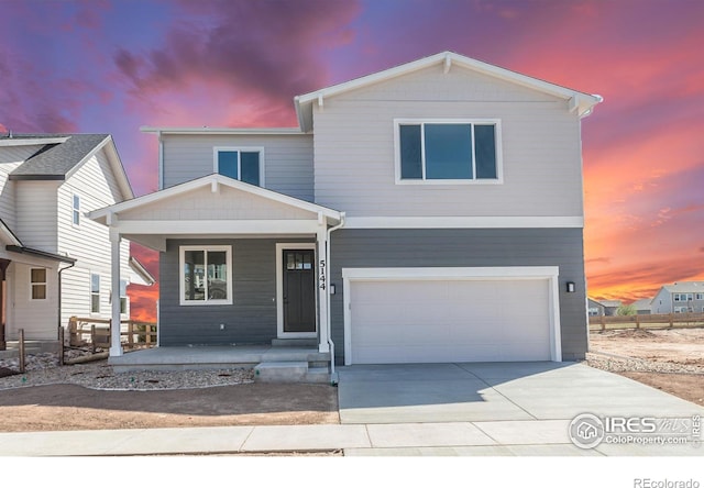 5144 Beckworth St, Timnath, CO 80547 - view of front of property featuring a porch, a garage, and concrete driveway