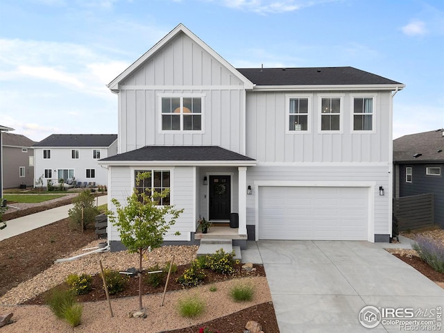 2412 Cottongrass Ave, Loveland, CO 80538 - modern farmhouse style home featuring a shingled roof, an attached garage, board and batten siding, and concrete driveway