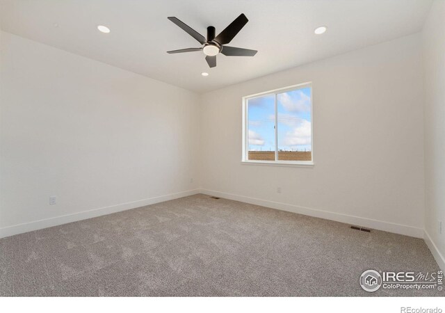 unfurnished room with carpet, a ceiling fan, baseboards, visible vents, and recessed lighting