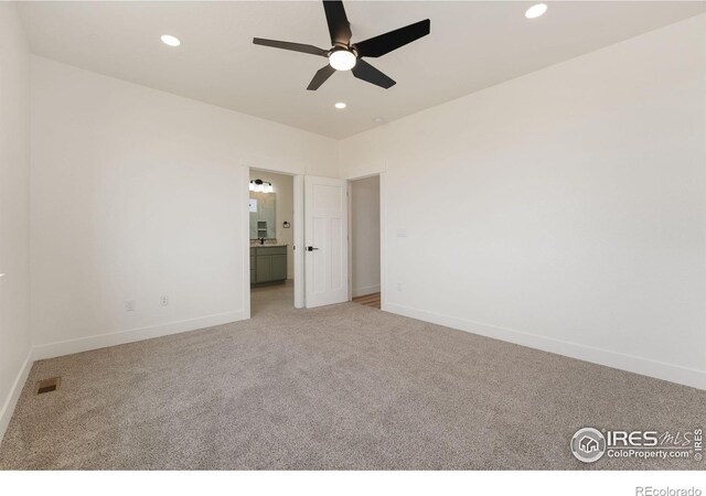 unfurnished bedroom with baseboards, visible vents, recessed lighting, and carpet