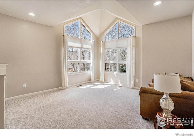 2409 Denby Ct, Fort Collins, CO 80526 - living area featuring plenty of natural light, carpet floors, lofted ceiling, baseboards, and recessed lighting