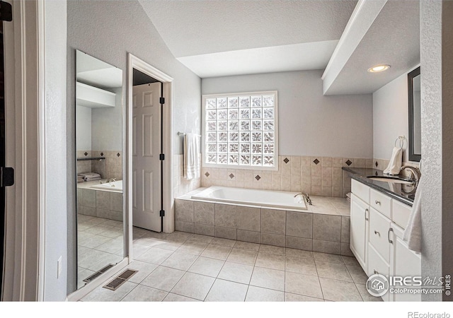 2409 Denby Ct, Fort Collins, CO 80526 - full bathroom featuring tile patterned floors, a garden tub, and vanity
