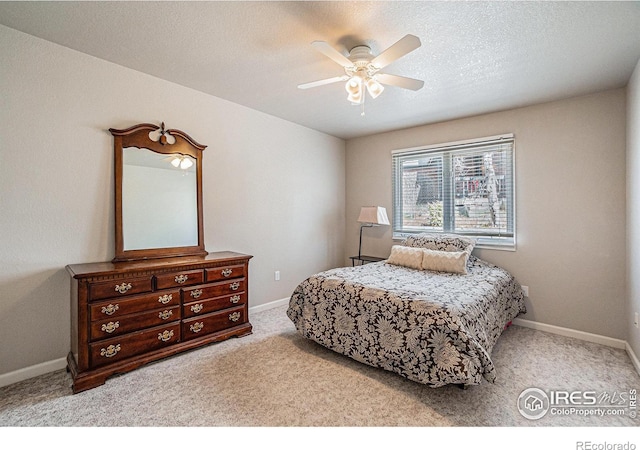 2409 Denby Ct, Fort Collins, CO 80526 - carpeted bedroom with baseboards, ceiling fan, and a textured ceiling