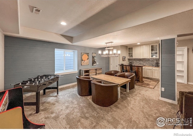 playroom with light carpet, baseboards, a chandelier, recessed lighting, and a textured ceiling