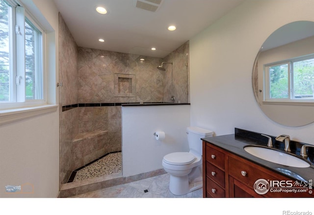 873 Cypress Dr, Boulder, CO 80303 - full bathroom with walk in shower, vanity, recessed lighting, and tile patterned floors